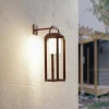 Lucande 2-i-1 LED-solcelle-væglampe Tilena, rustfarvet, rund, aluminium