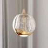 Lucande LED-pendellampe Hayley, Ø 9 cm, guldfarvet, glas