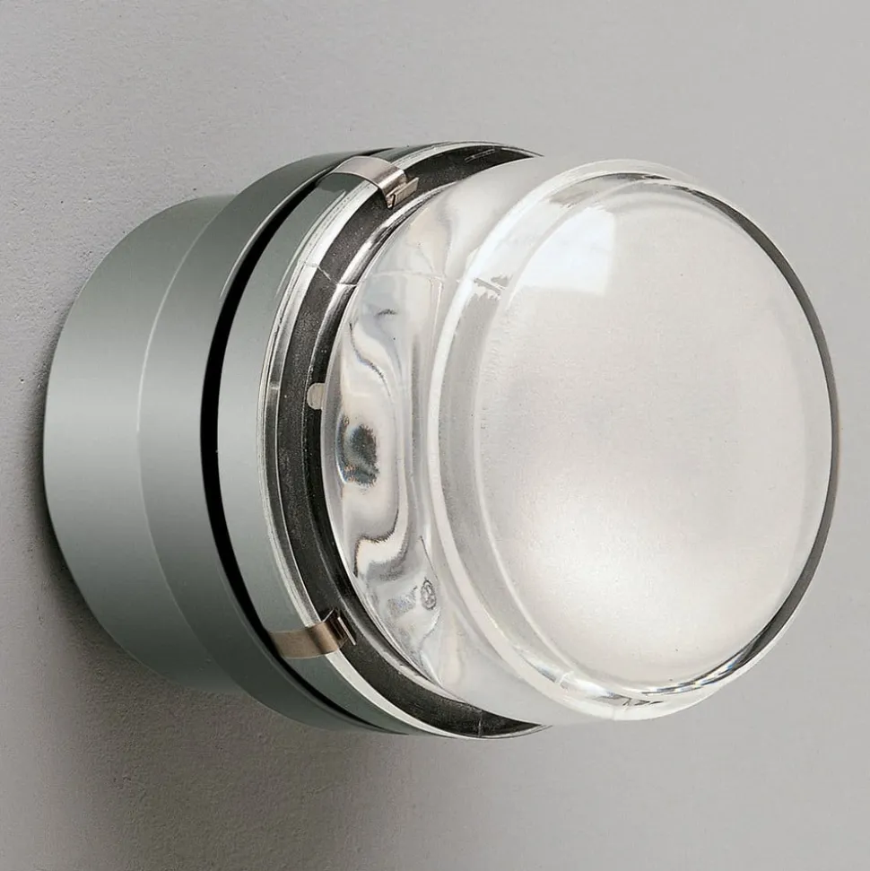 Oluce Fresnel - Væglampe med glaslinse IP44 krom