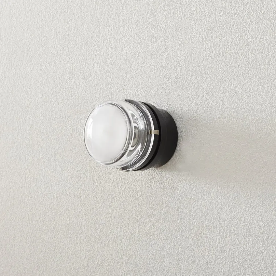 Oluce Fresnel væglampe m. glaslinse IP44 sort