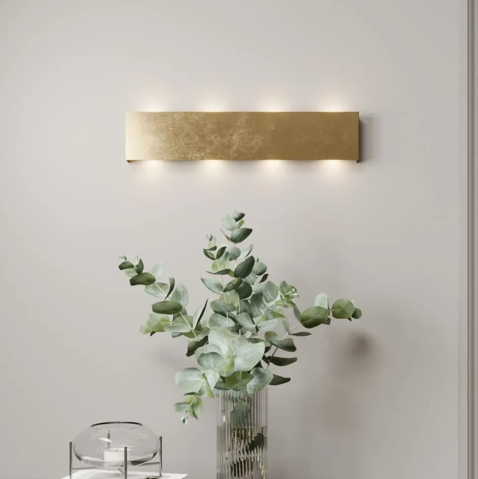 Quitani LED-væglampe Maja, guld antik, bredde 54 cm